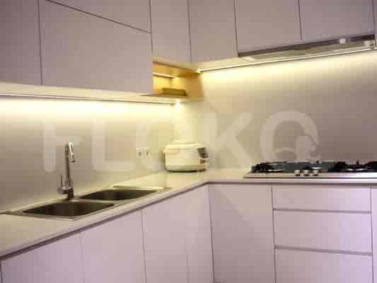 Modern white kitchen with appliances and countertop space.