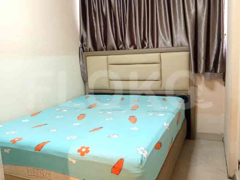 Bedroom with a bed and curtains.