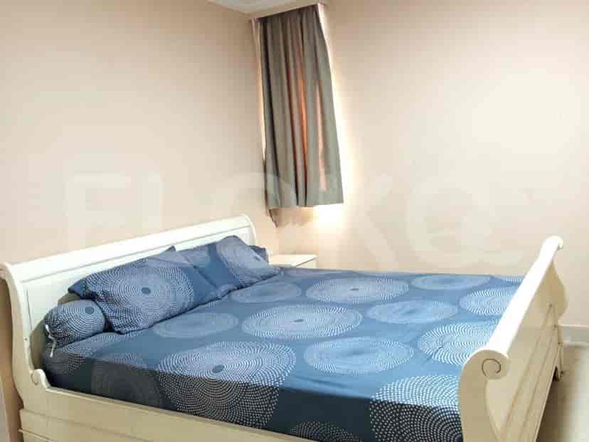 Bedroom with a bed and a window.