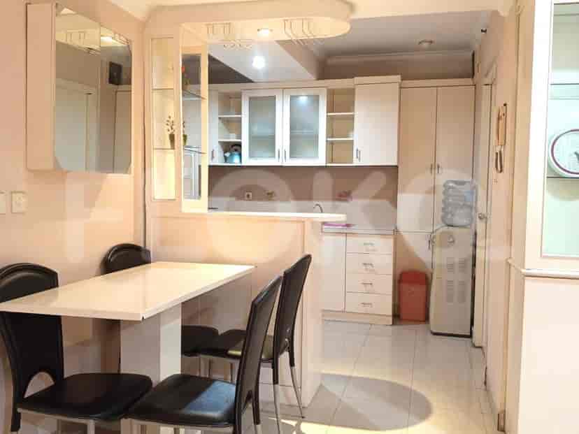 Kitchen with dining area and cabinets.