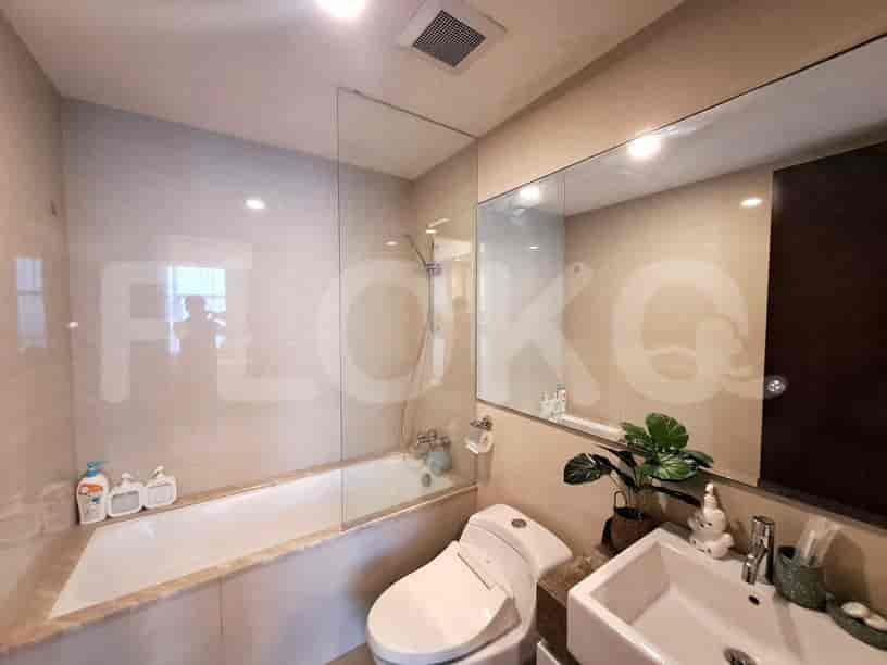 A modern bathroom with a bathtub and shower.