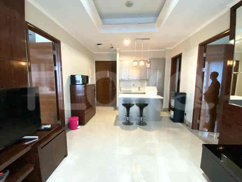 Open kitchen with a breakfast bar and a hallway leading to the bedrooms.