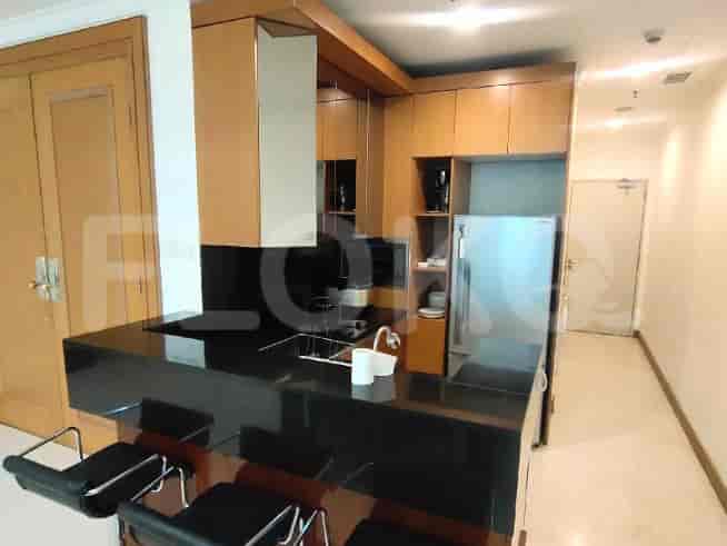 Modern kitchen with island and bar stools.