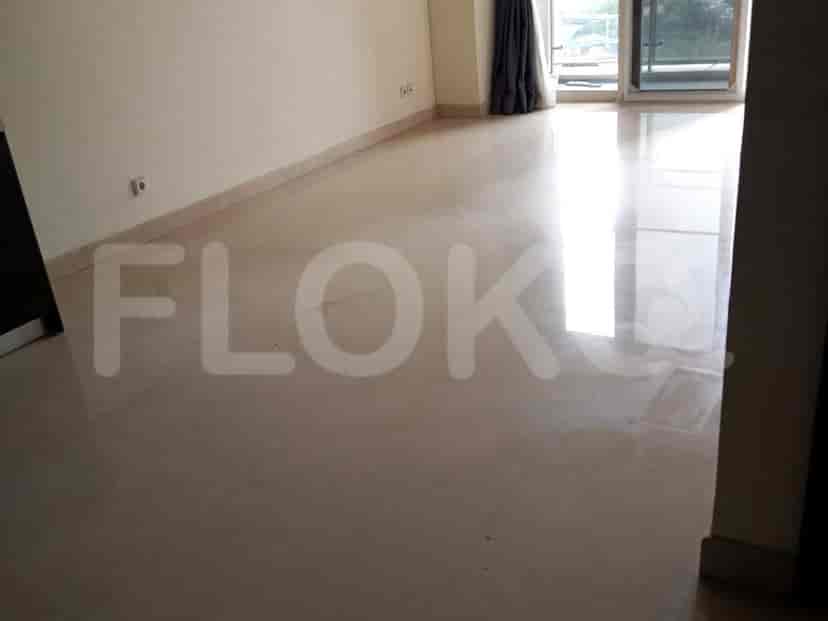 A hallway with polished floor and doorways.