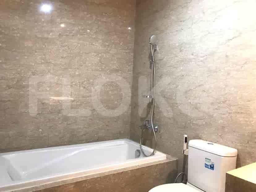 A bathroom with a bathtub and modern fixtures.