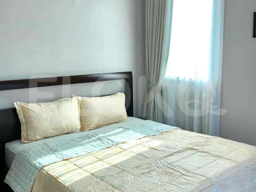Bedroom with a bed and curtains.