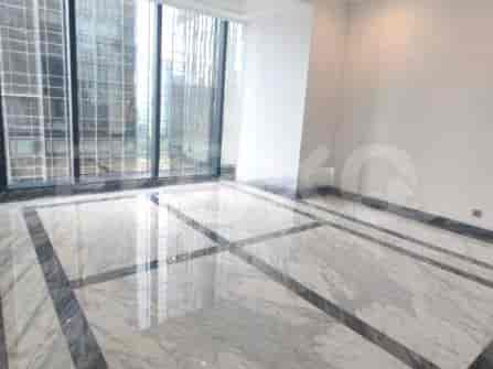 A living space with a marble floor and large windows.