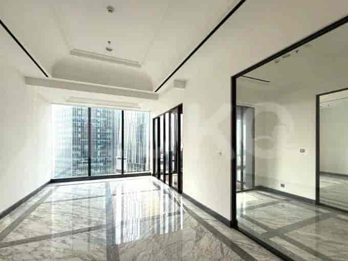 Spacious living area with marble flooring, large windows overlooking the city, and architectural details.