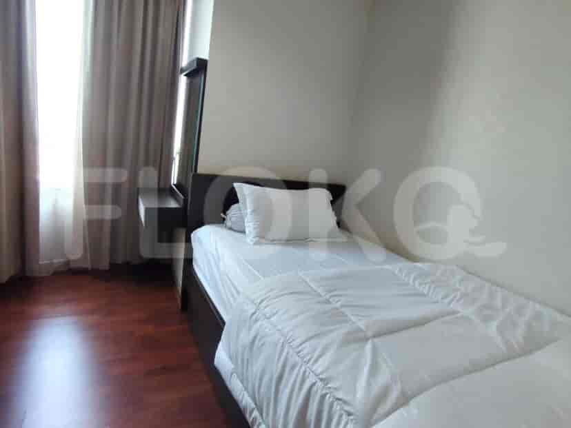 Single bed in a bedroom with minimal decor.