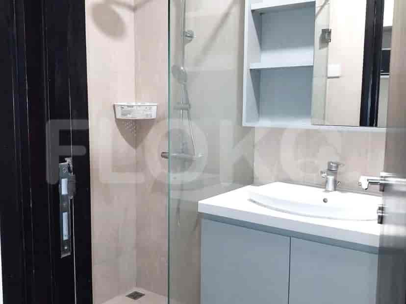 Bathroom with a shower, vanity, and a mirror.