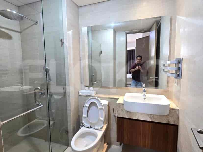A contemporary bathroom with a glass-enclosed shower and modern fixtures.