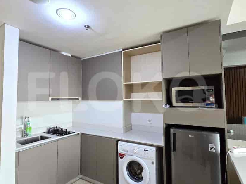 A fully-equipped modern kitchen with integrated appliances.