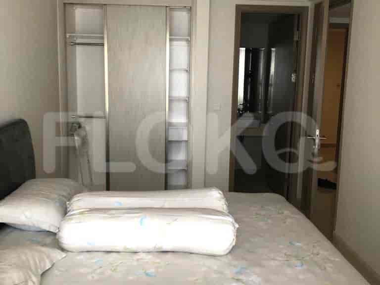 Bedroom with bed, wardrobe and bathroom visible.