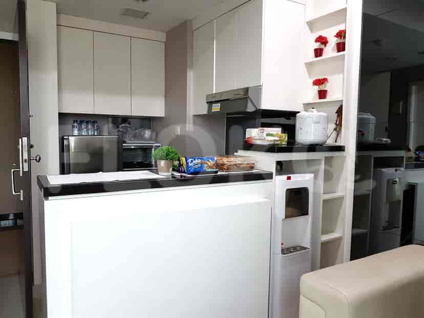 Kitchen featuring cabinets, countertops, and a water dispenser.