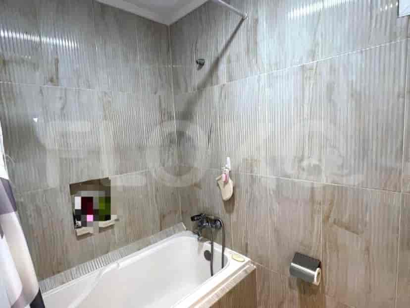 A bathroom with a bathtub and shower.
