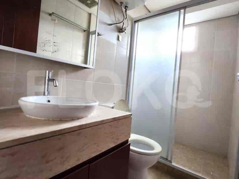 A bathroom with a sink and a shower.