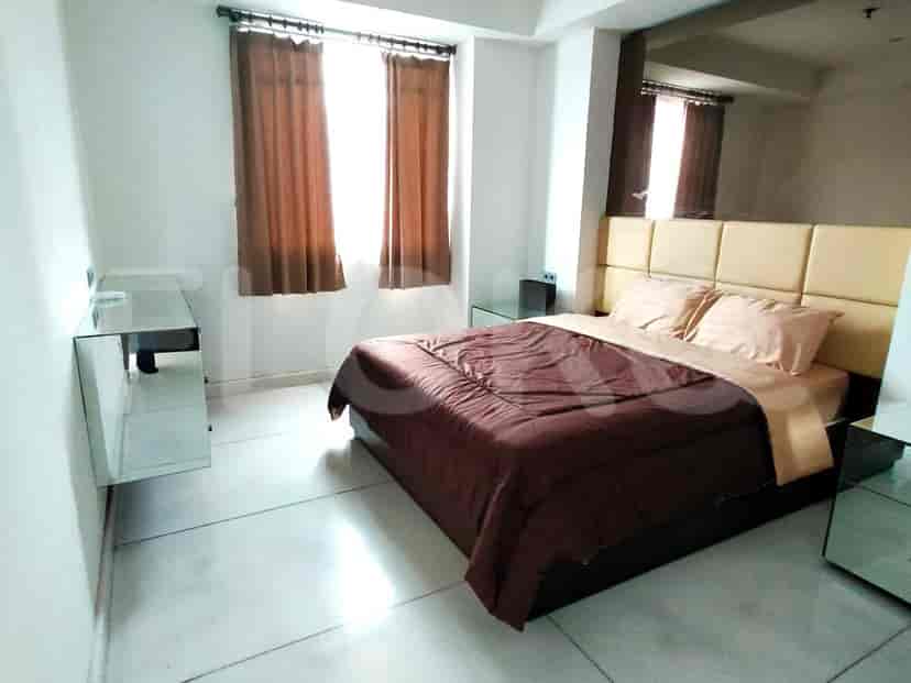 Another bedroom with bed, side tables.