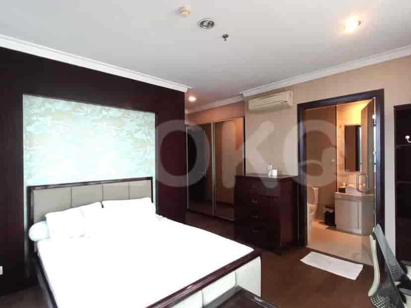 A well-appointed bedroom with a large bed and ensuite bathroom access.