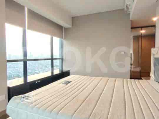 Bedroom featuring a large bed with a city view.