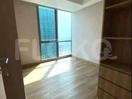 Bedroom with a view and wooden flooring.