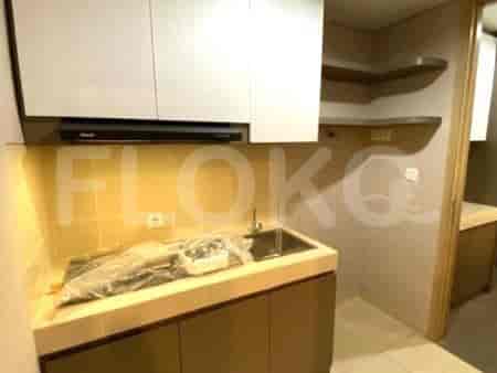 Compact kitchen with basic appliances.