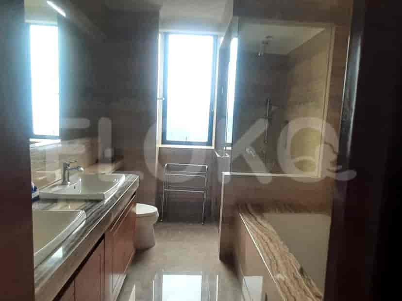A modern bathroom with a shower, tub, and double vanity.