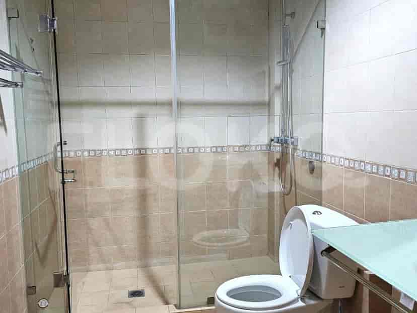 Clean and modern bathroom with a glass shower enclosure.