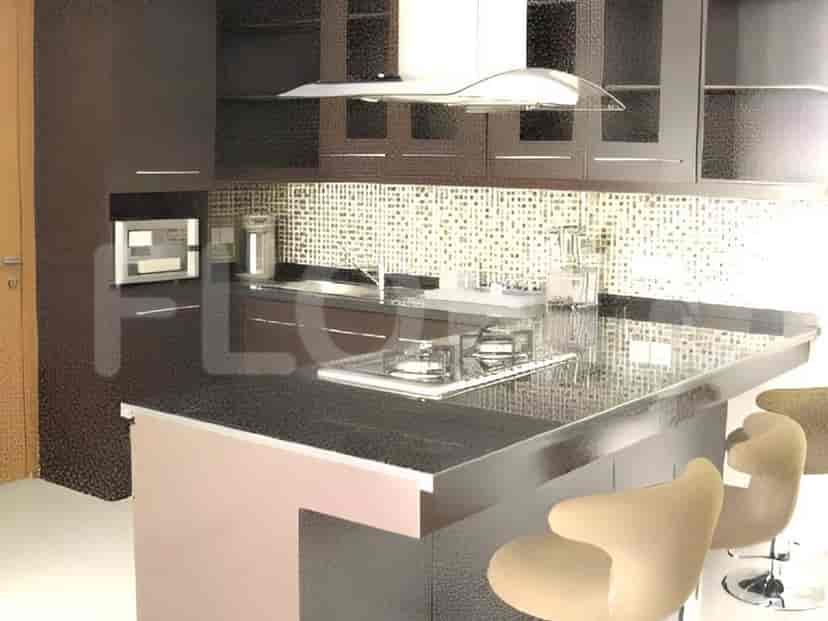 Modern kitchen with cabinets and a breakfast bar.
