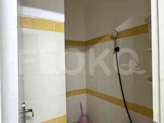 A clean bathroom with a shower, and a sink.