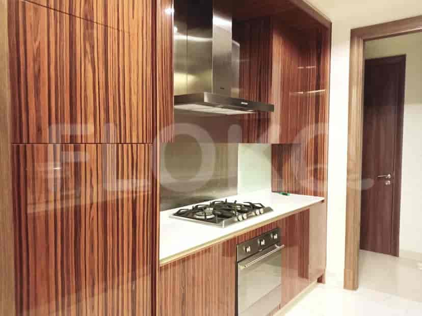 A modern kitchen with wooden cabinets and stainless steel appliances.
