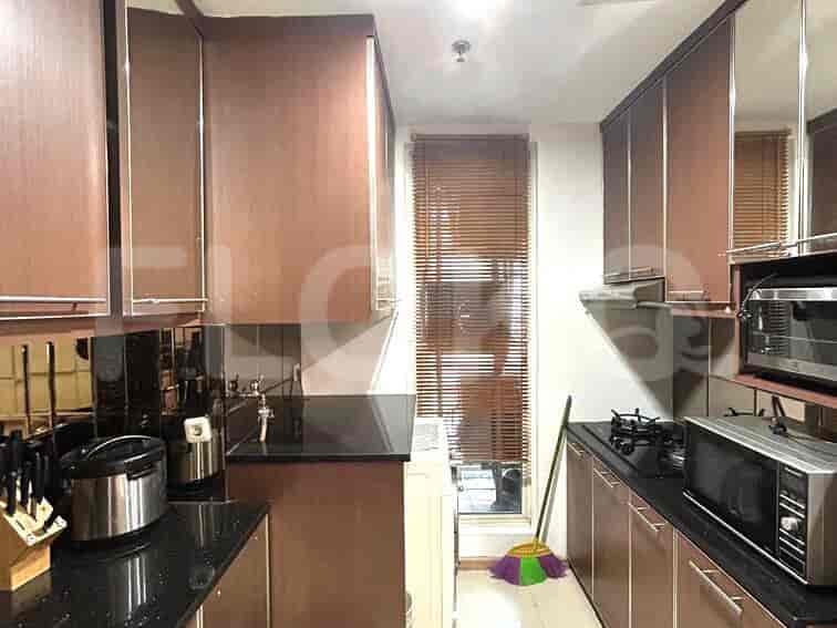 Another view of the modern kitchen setup with dark cabinets.