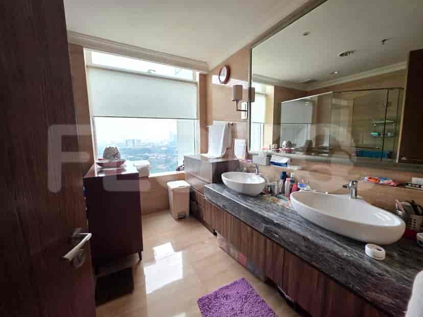 Modern bathroom with a double vanity and large mirror.
