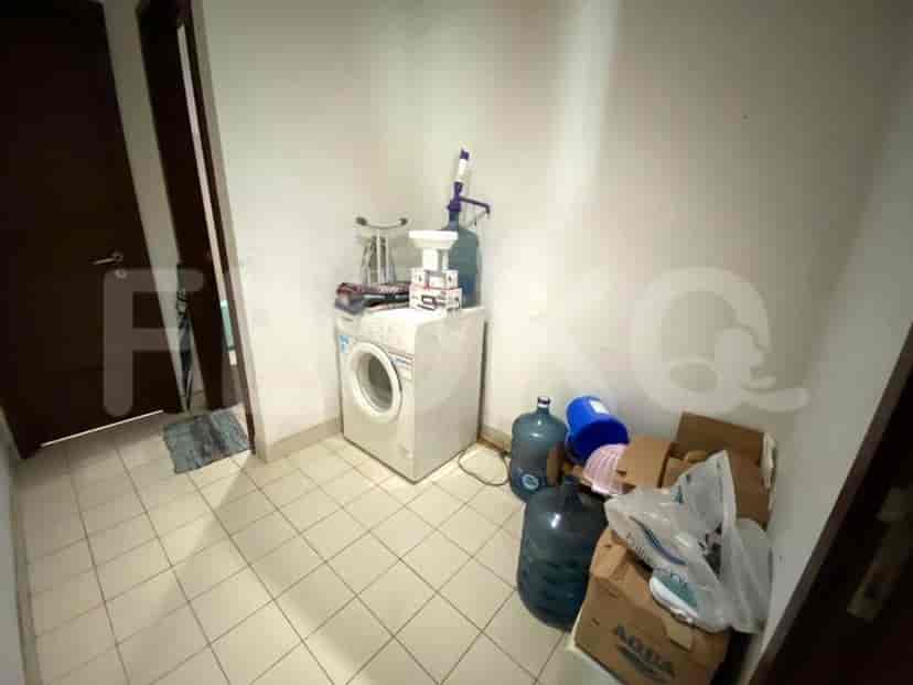 Utility room or laundry area with a washing machine and storage.