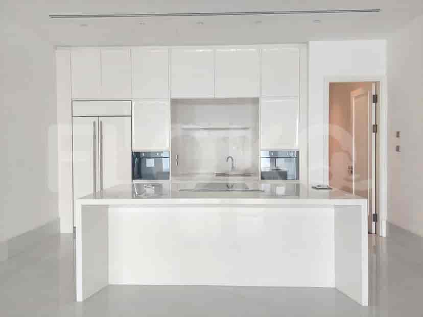 Modern kitchen with white cabinetry and island.