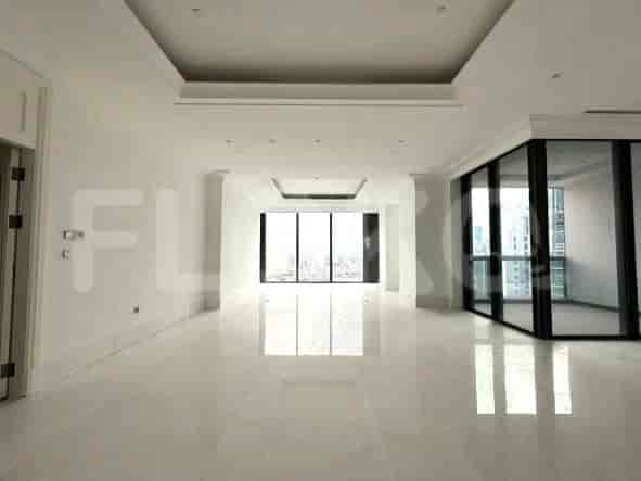 Living room with large windows, a marble floor, and white walls.