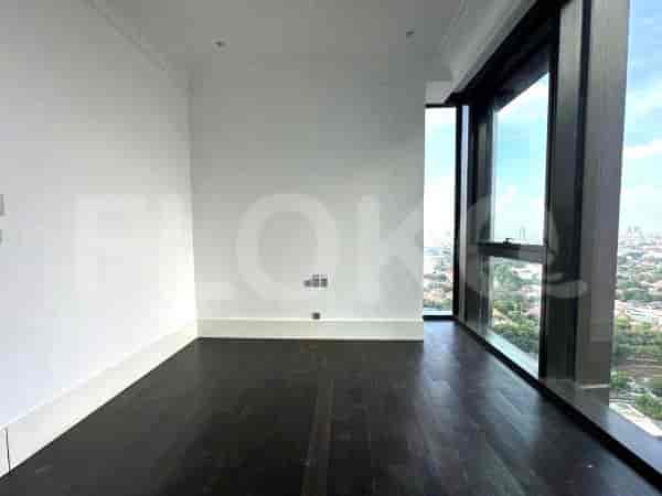 Bedroom with dark wooden floor and a large window with a city view.