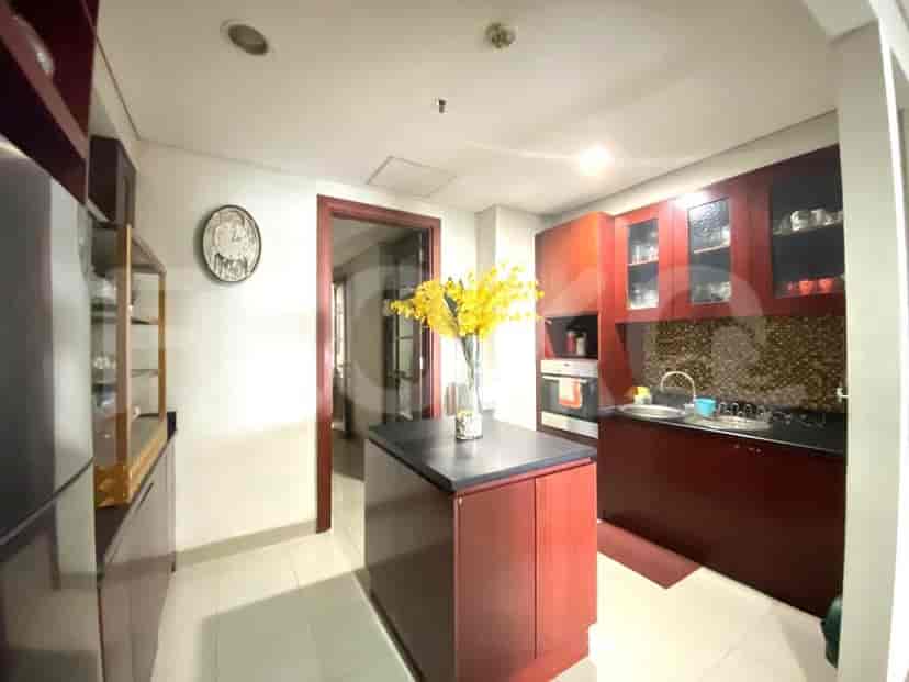 A kitchen with cabinetry, a countertop, and a stove.