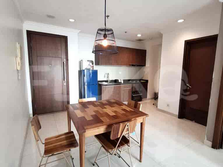 A kitchen with a dining table.