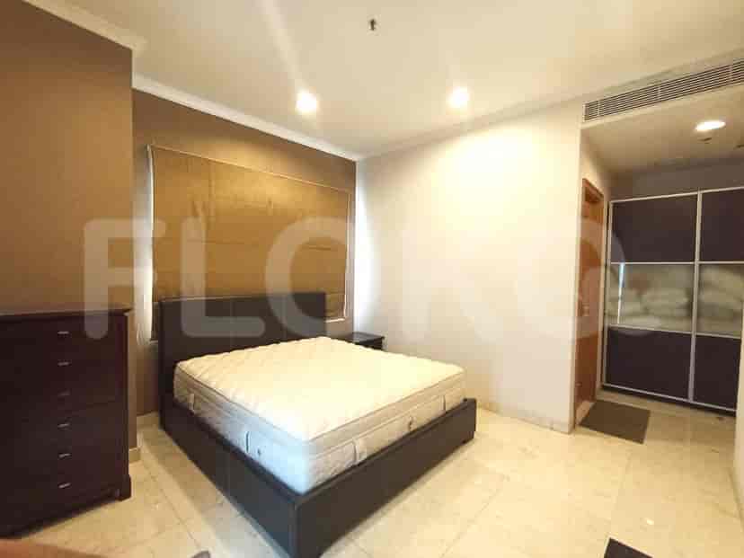 A bedroom featuring a bed, a dresser, and a nightstand.