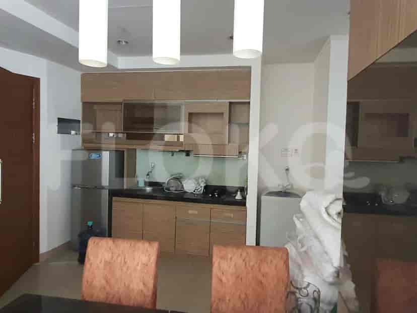 Kitchen with cabinets, appliances, and dining table.