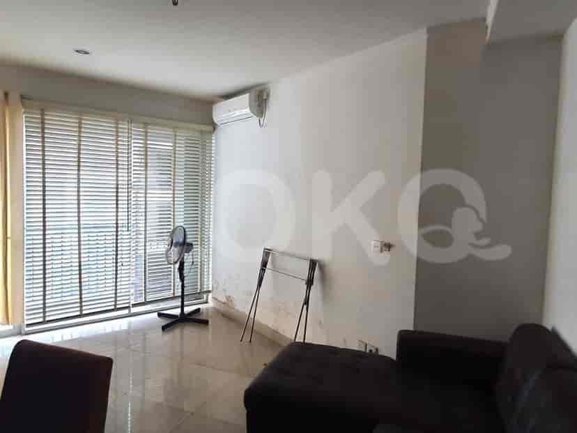 Living room with blinds, fan, and AC unit.