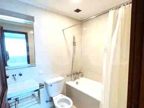 Bathroom featuring a bathtub, toilet, and sink.