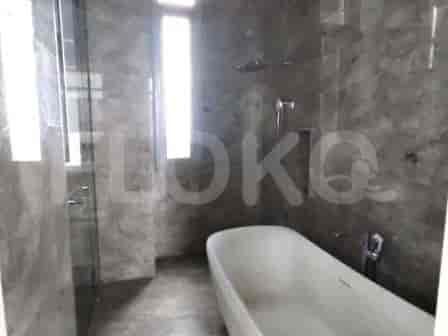 Bathroom with a bathtub, shower, and modern design.