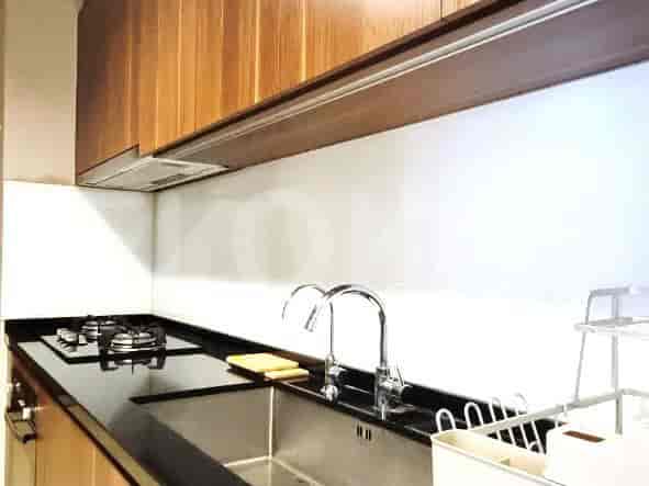 Kitchen with countertops, a stove, and a sink.