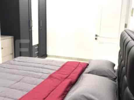 A modern bedroom with a double bed, wardrobe and side table.