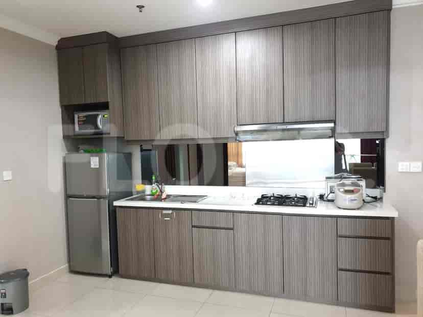 Modern kitchen with cabinetry, appliances, and white countertops.