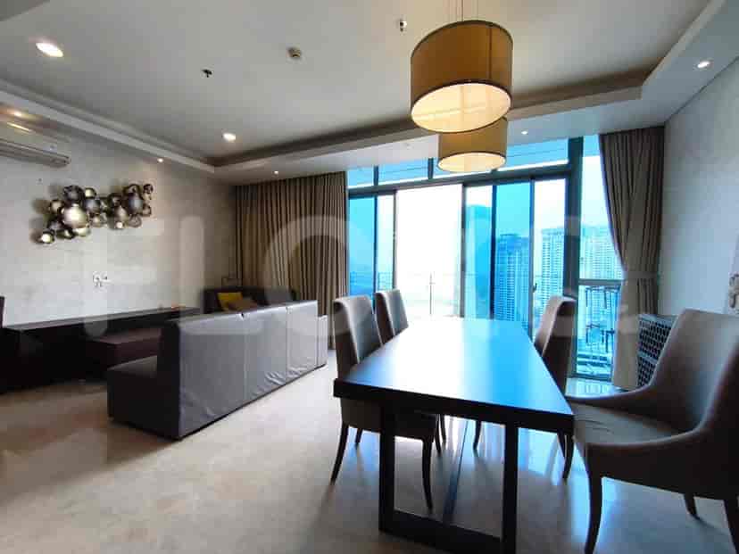 A combined living and dining space featuring a dining table, chairs, and expansive views.