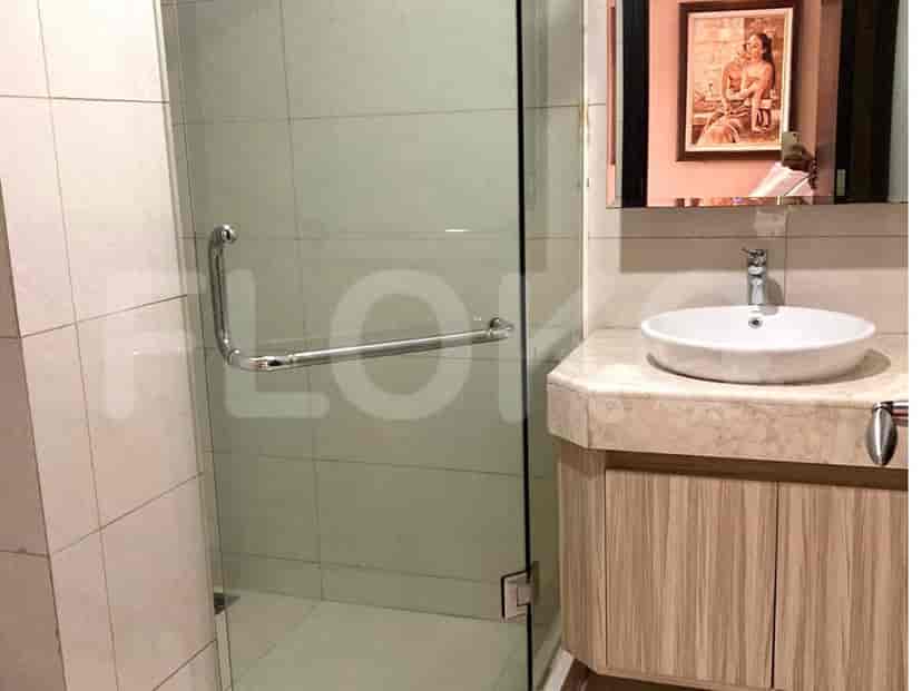 A bathroom with a shower and vanity.