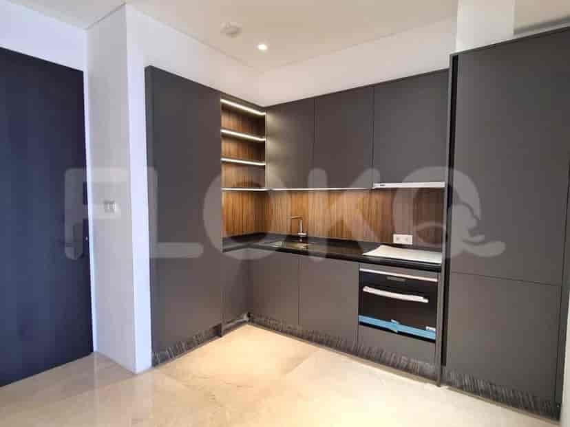 Modern kitchen with dark grey cabinets.