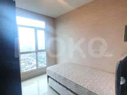 Bedroom with a single bed and a large window.
